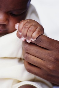 Infant Grasping Mother's Finger